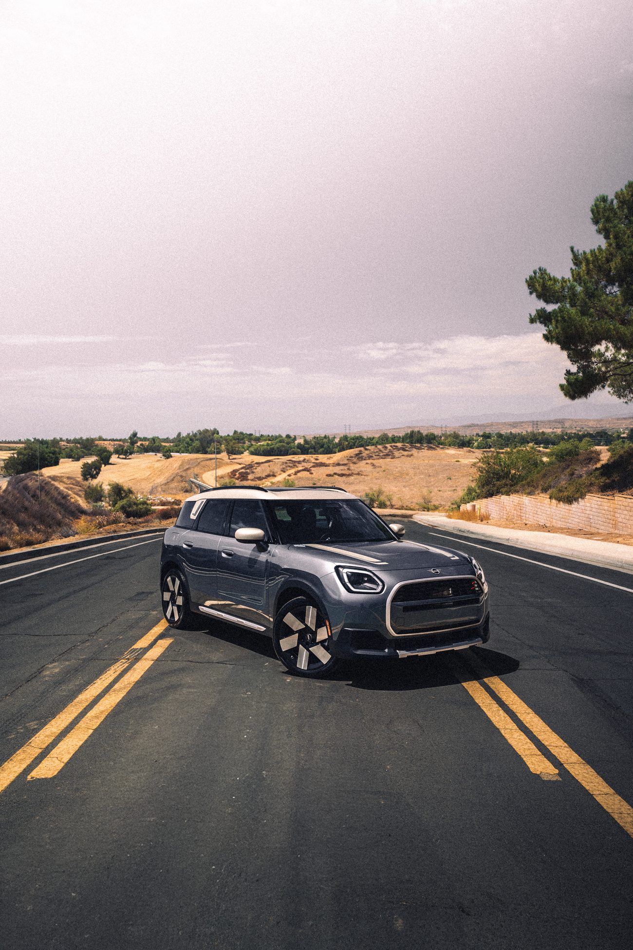 Gray 2027 Mini Countryman with tinted windows on a Beaumont road